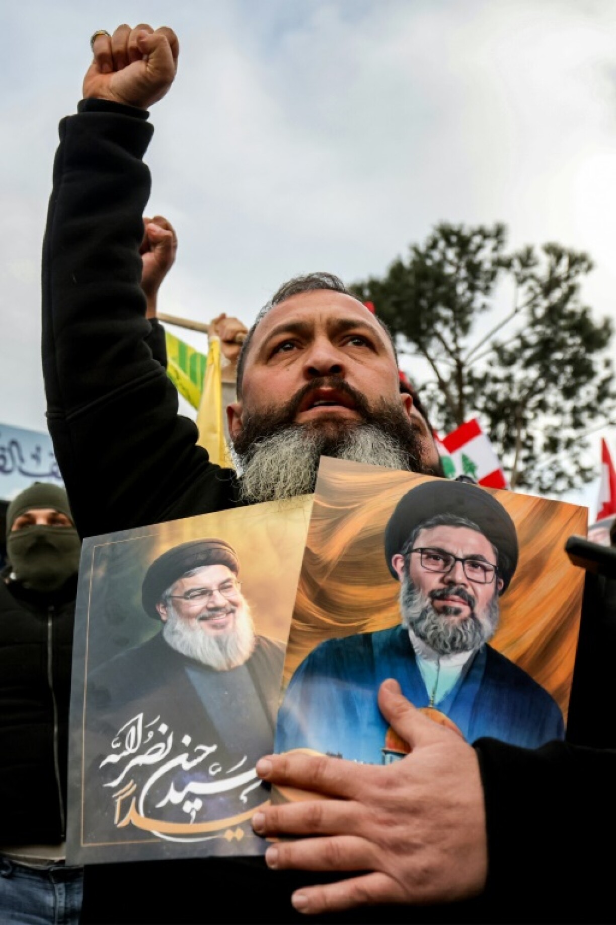 Protestors gathered to block the road to Beirut's airport after the Lebanese government decided to halt flight from Iran