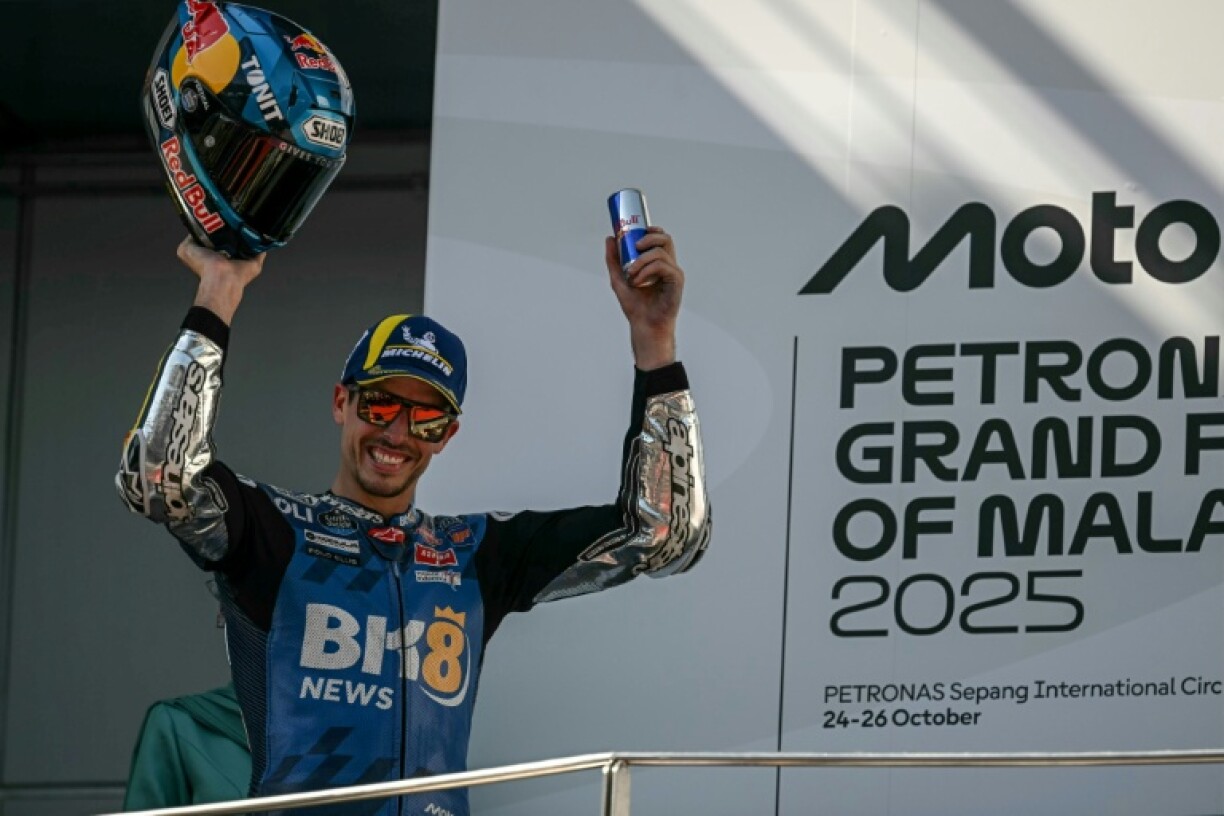 Alex Marquez celebrates on the podium