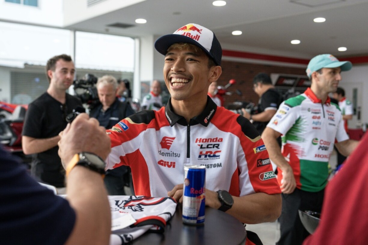 Thai rider Somkiat Chantra smiles as he signs autographs at a MotoGP launch event in Bangkok earlier this month