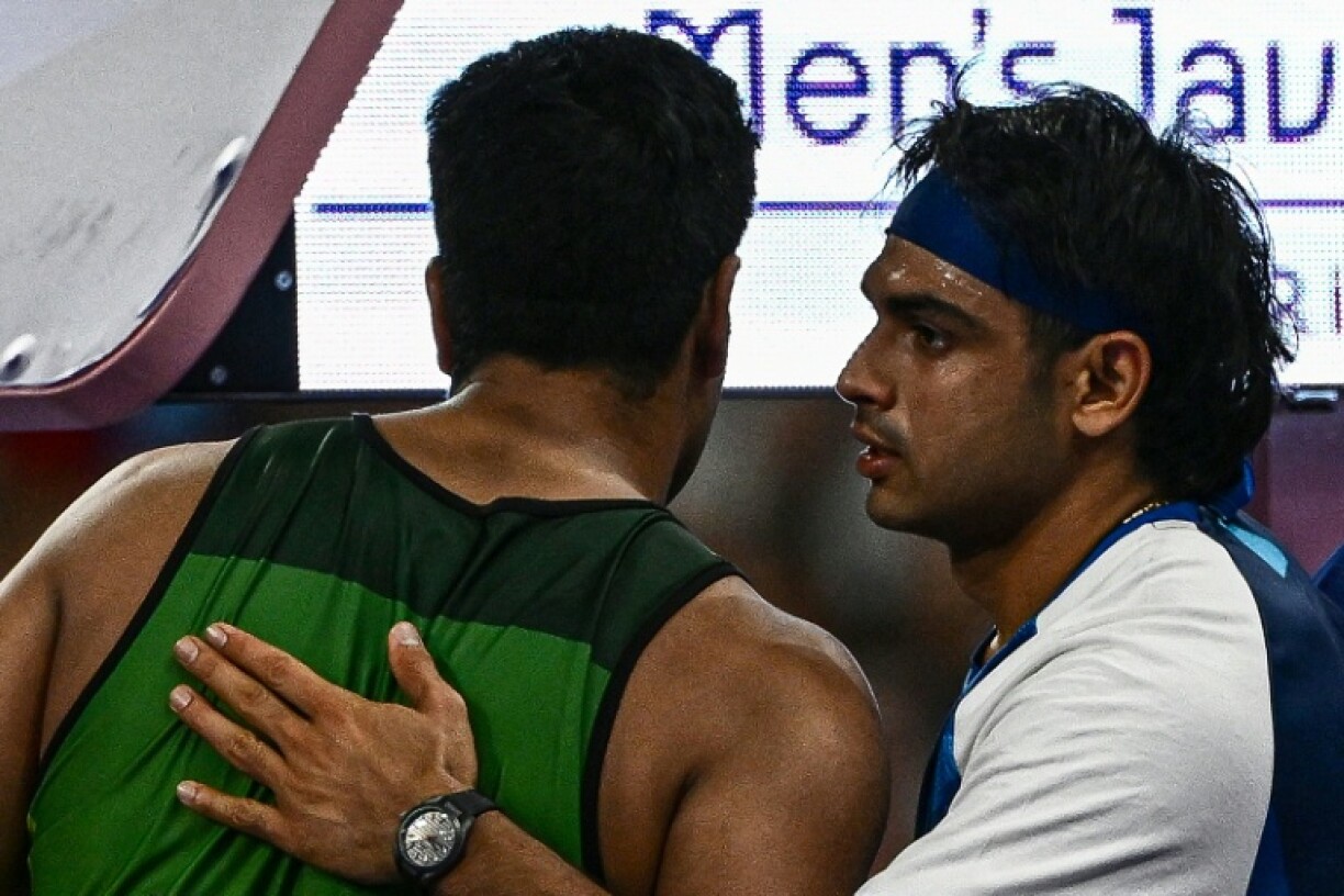 India's Neeraj Chopra (R) congratulates Pakistan's Arshad Nadeem after the men's javelin throw final in Paris