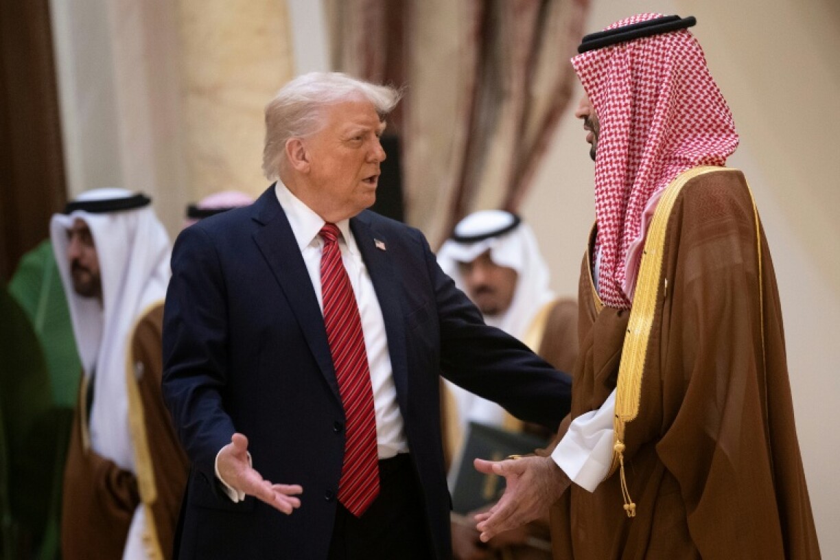 Trump (L) met Saudi Crown Prince Mohammed bin Salman in Riyadh in May