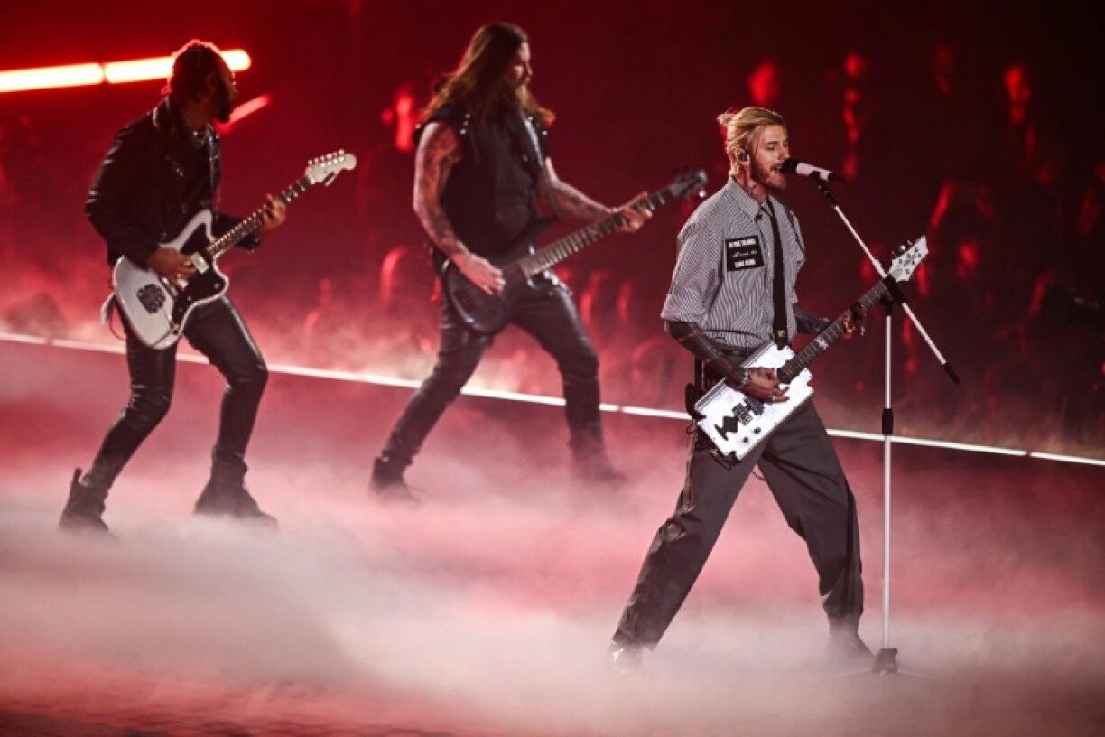 US rapper Machine Gun Kelly performs during the 2025 Formula One season launch at London's O2 Arena