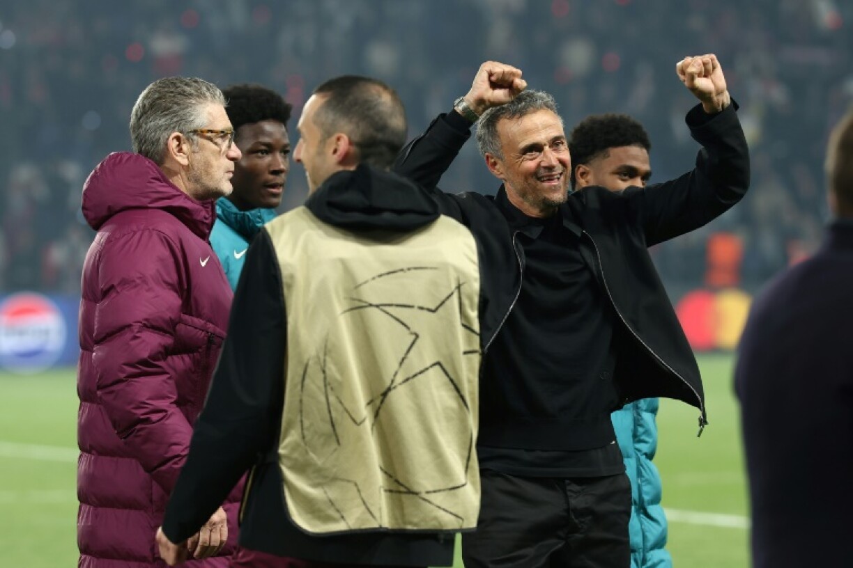 PSG coach Luis Enrique (R) celebrates his team's victory over Arsenal in Wednesday's Champions League semi-final