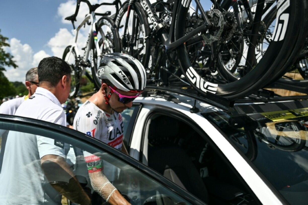 Joao Almeida climbing into his team car