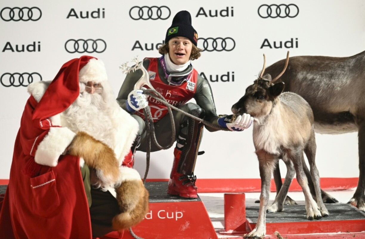 Lucas Pinheiro Braathen feeds his prize reindeer