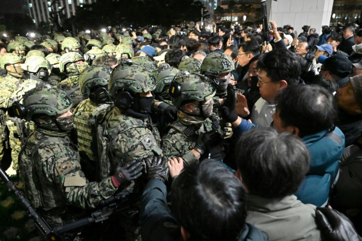 Soldiers try to enter the National Assembly after South Korean President Yoon Suk Yeol declared martial law