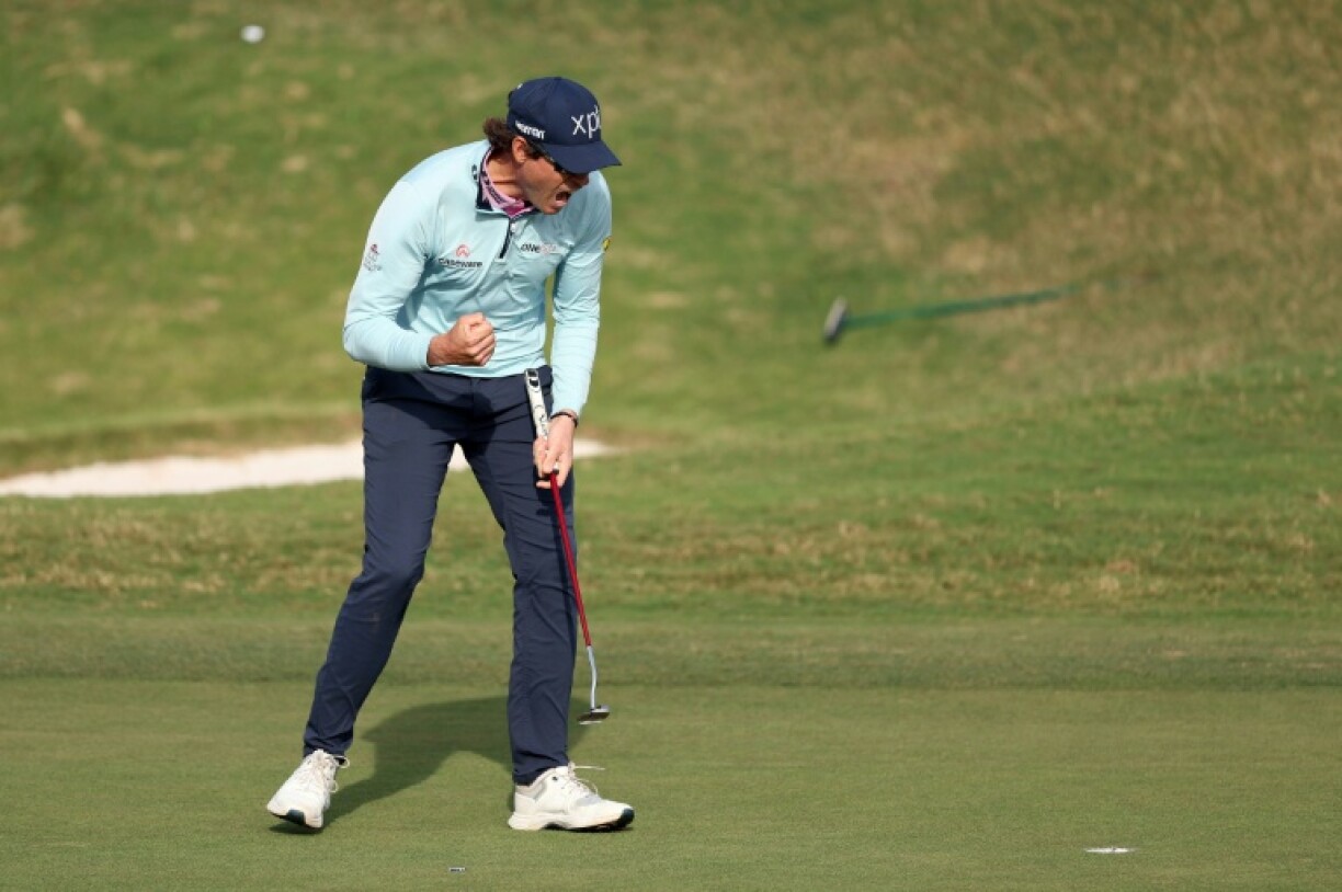 Adam Schenk of the United States celebrates after a par putt on the 18th hole gave him the title at the Bermuda Championship for his first US PGA Tour victory