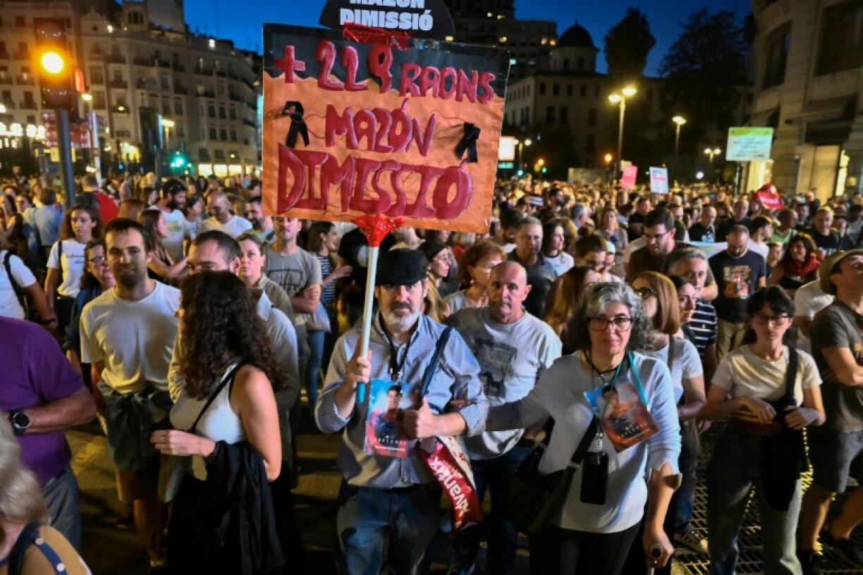Demonstrators, many carrying photos of the victims, called for regional leader Carlos Mazon to resign