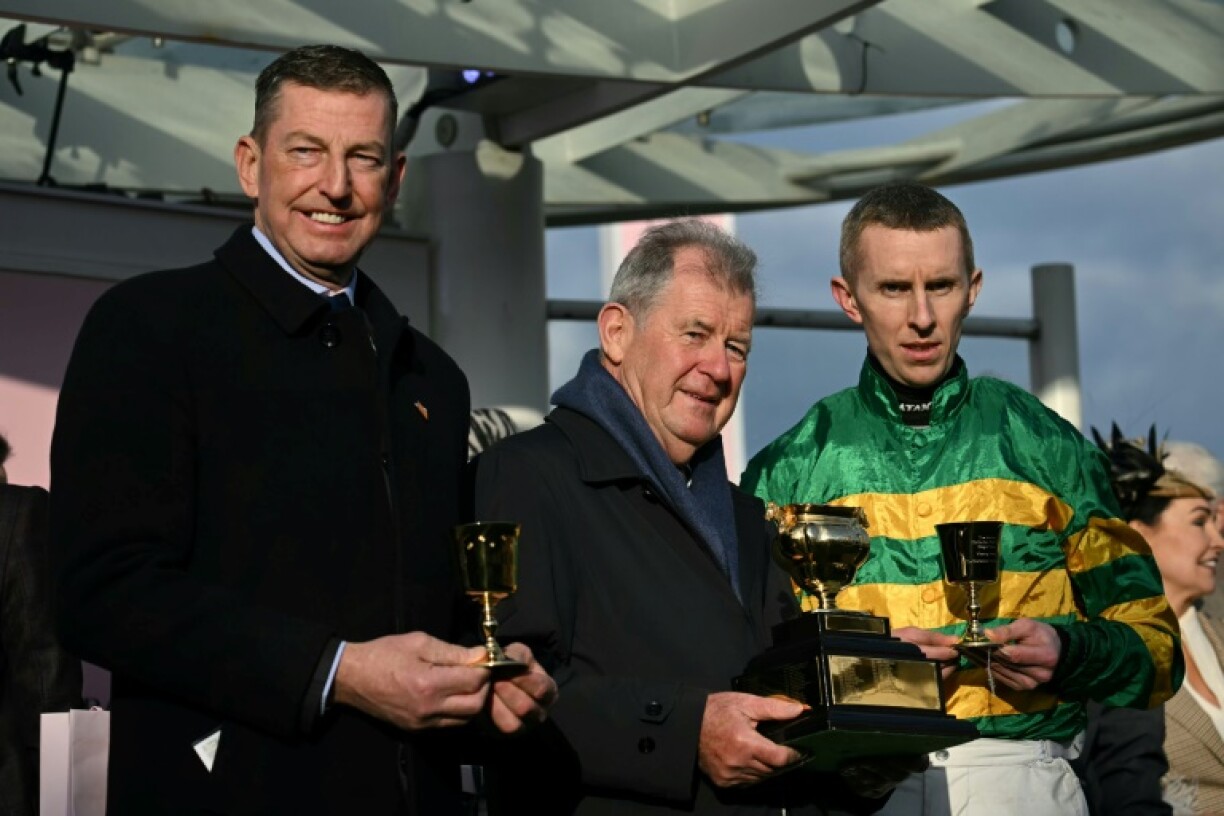 (L-R) Trainer Gavin Cromwell, owner JP McManus and jockey Mark Walsh bid to add the Grand National with Perceval Legallois to their Cheltenham Gold Cup success with Inothewayurthinkin