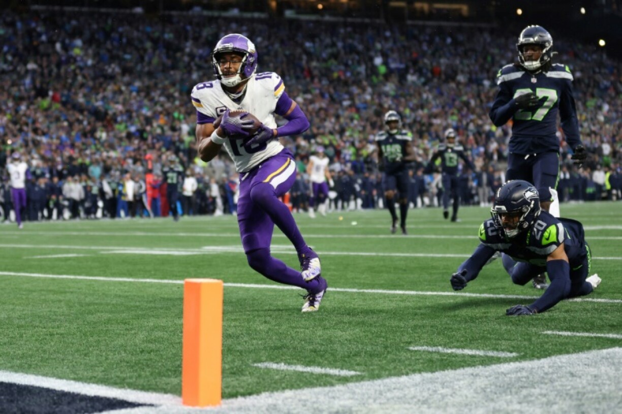 Justin Jefferson of the Minnesota Vikings scores a touchdown in the Vikings' NFL victory over the Seattle Seahawks