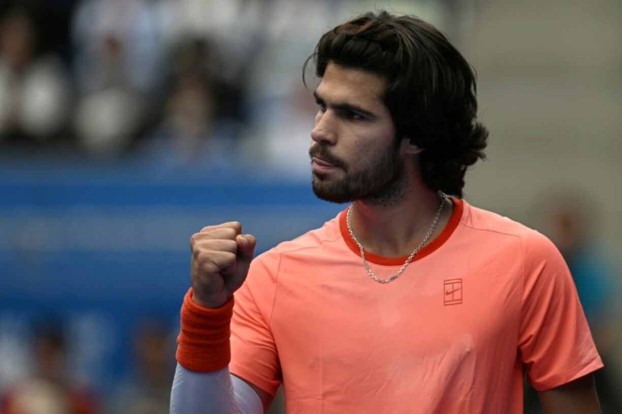 Spain's Carlos Alcaraz reacts as he plays against Canada's Denis Shapovalov during their men's singles quarter-final tennis match at the ATP Tour Japan Open Tennis Championships at the Ariake Tennis Forest Park in Tokyo on October 4, 2026.