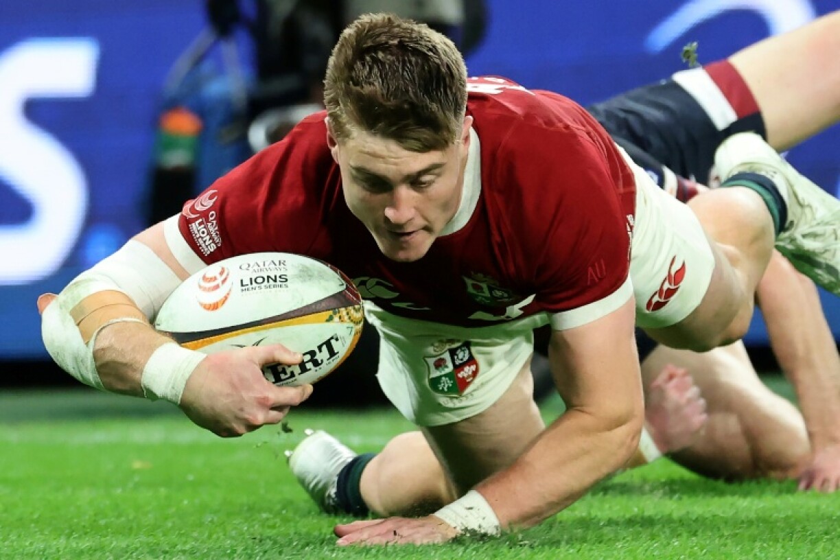 British and Irish Lions wing Tommy Freeman scores against Queensland Reds