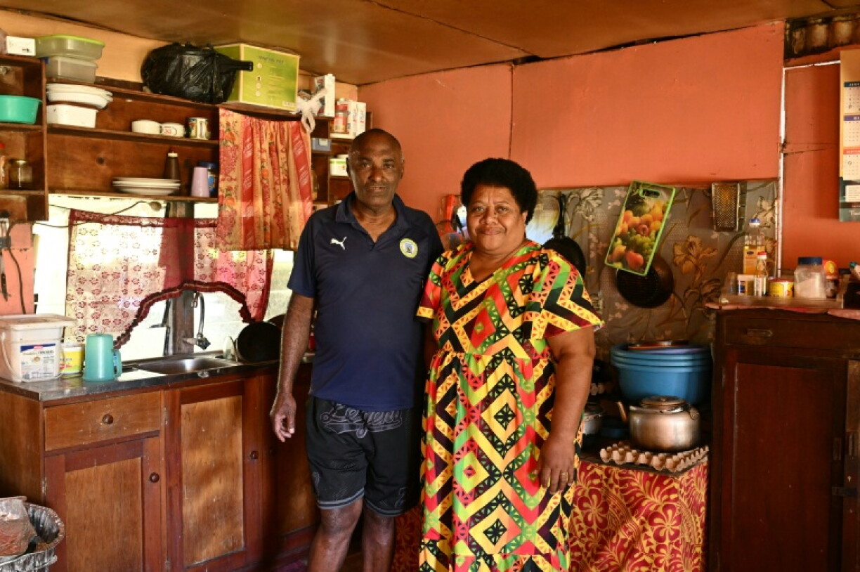 This photo taken on October 9, 2026 shows Vereniki Nalio and his wife, Salaseini Nalio, posing in the kitchen of their home in Rukurukulevu village. Nalio says the global energy squeeze since the Middle East war has led more villagers to consider switching to renewables.