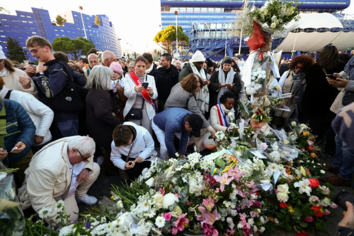 People layed flowers and lit candles in tribute to Mehdi Kessaci at the roundabout where he was murdered and to protest against drug trafficking, in Marseille, France's second-largest city