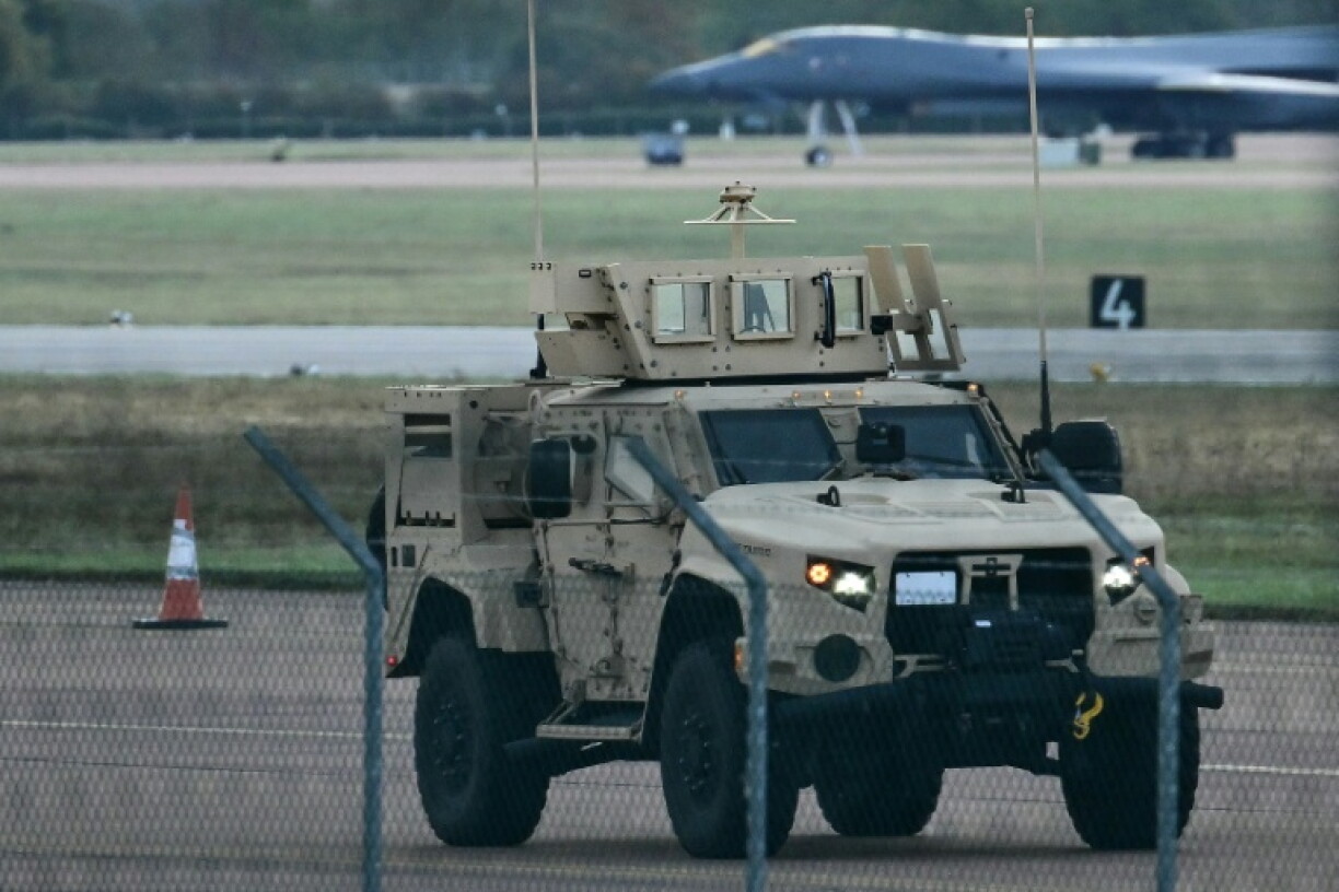 An armoured vehicle patrols RAF Fairford base, southwest England