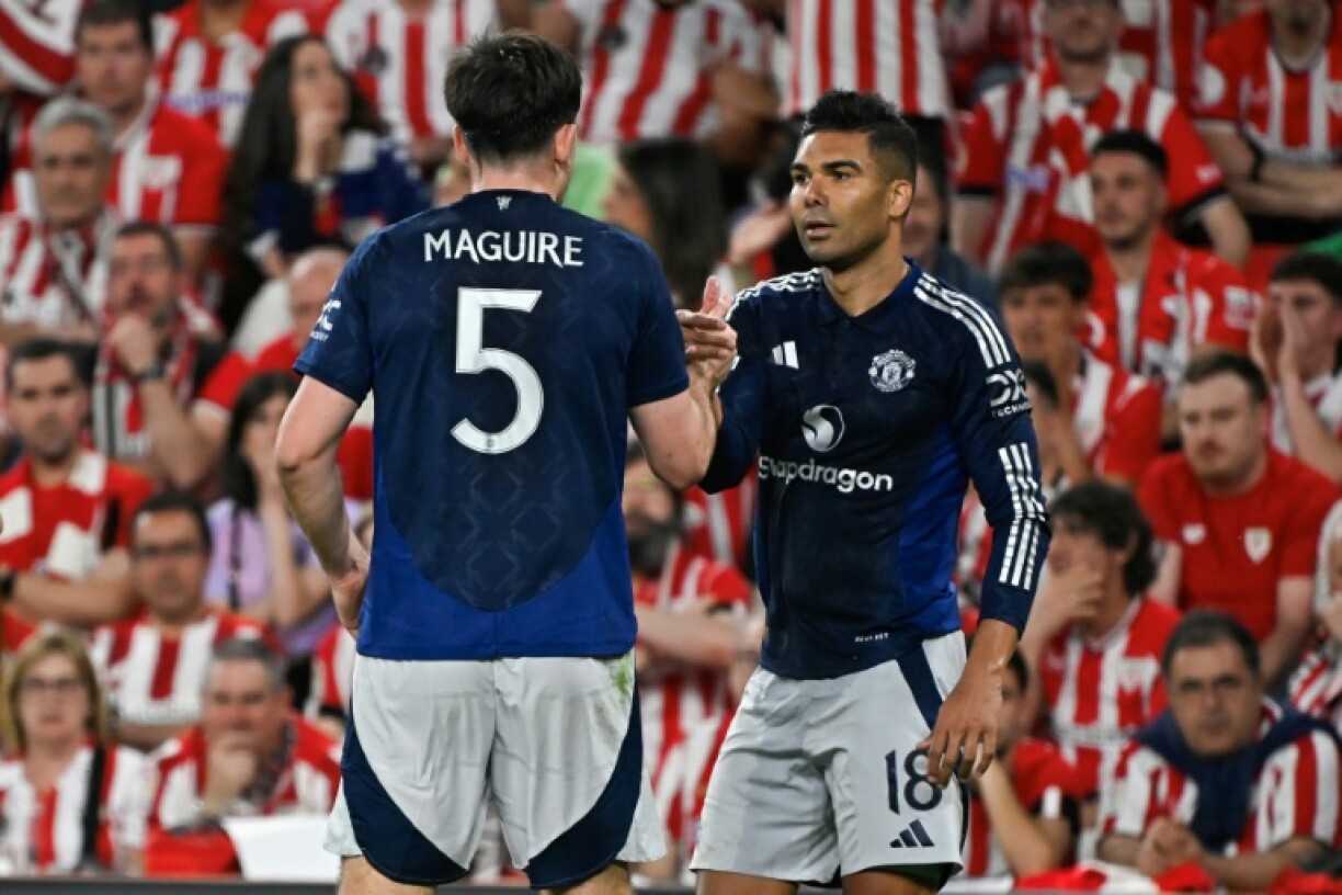 Manchester United midfielder Casemiro celebrates his goal with Harry Maguire
