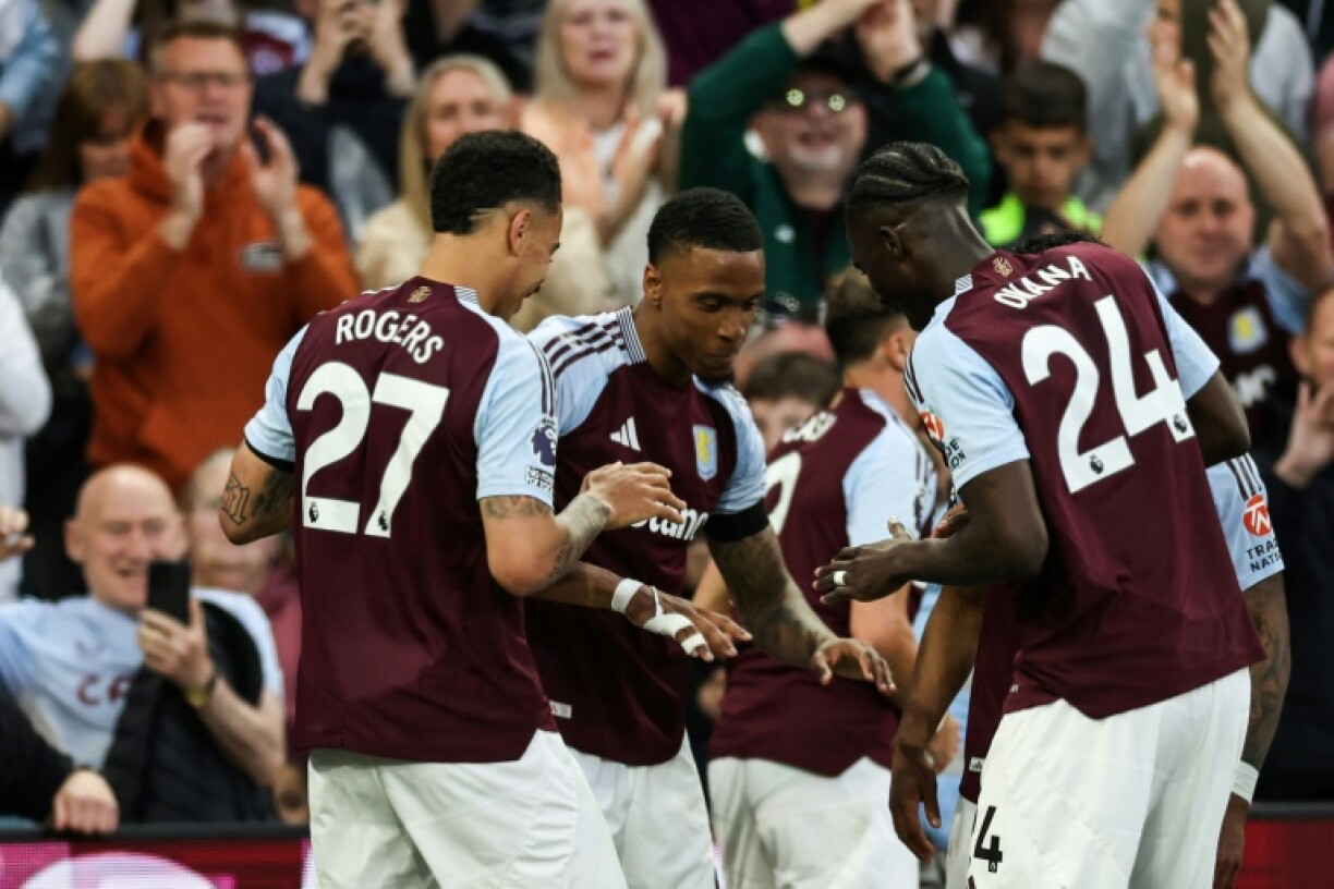 Aston Villa's Ezri Konsa (C) celebrates after scoring against Tottenham