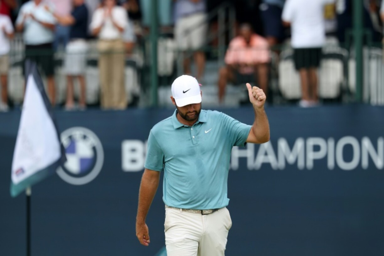 World number one Scottie Scheffler of the United States celebrates his 82-foot birdie chip in on the 17th hole on his way to winning the US PGA Tour's BMW Championship