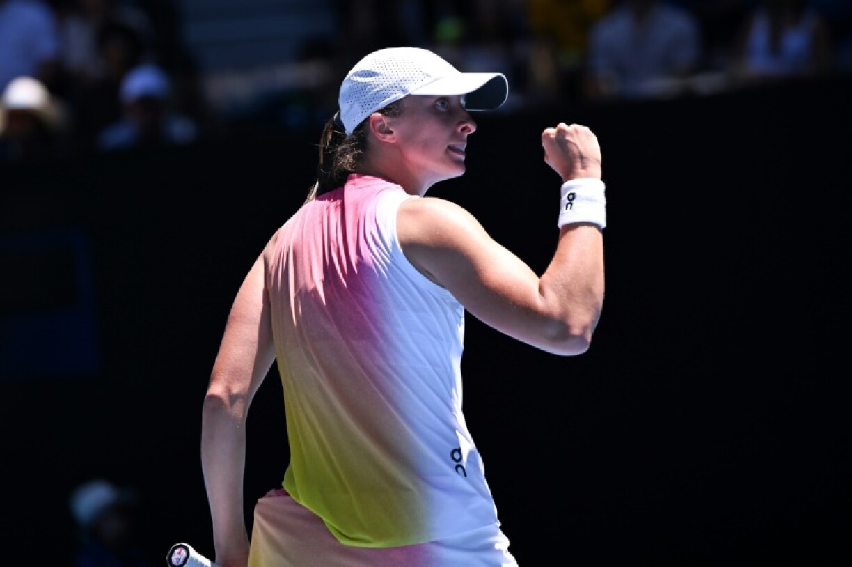 Poland's Iga Swiatek celebrates against Emma Raducanu