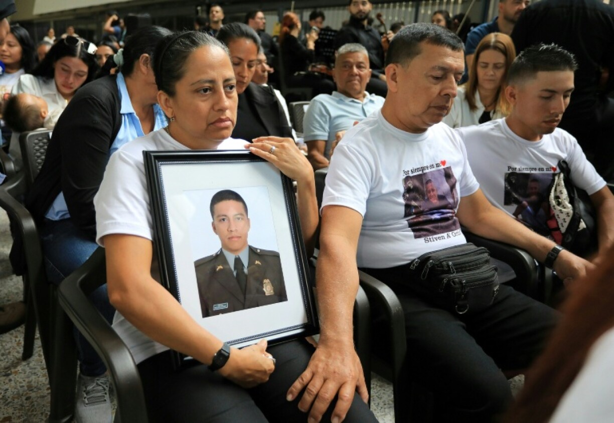 Relatives attend a tribute to 13 slain police officers at the office of the governor of Antioquia in Medellin, Colombia, on August 28, 2025