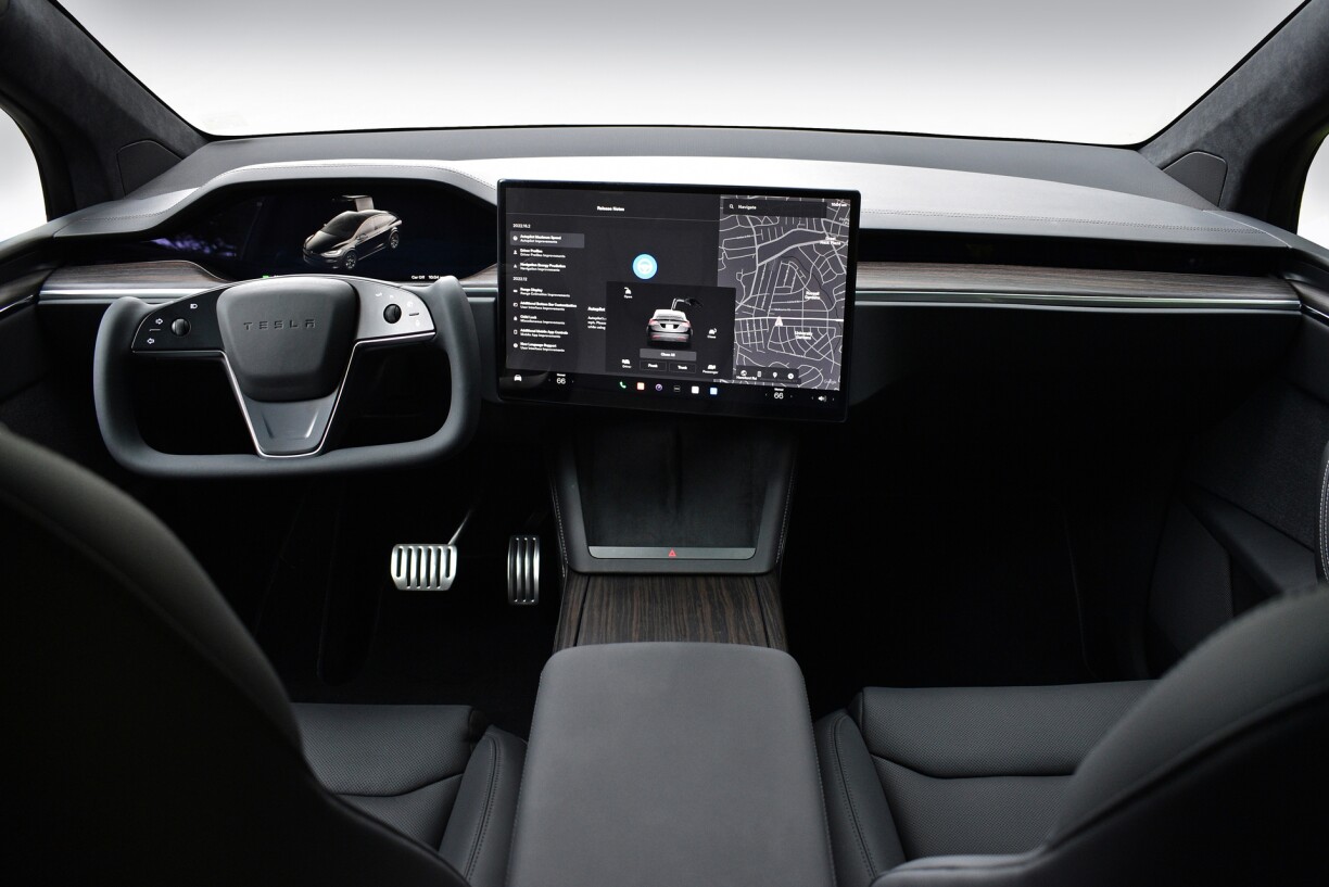 Tesla has made 'uncluttered' dashboards its trademark, with a vast screen centralising all the controls, as seen here inside a Model X.