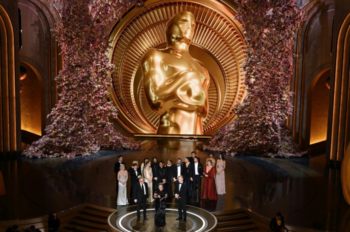 'Oppenheimer' producers Emma Thomas (C), Charles Roven (L) and British filmmaker Christopher Nolan accept the Oscar for best picture for 'Oppenheimer' in 2024