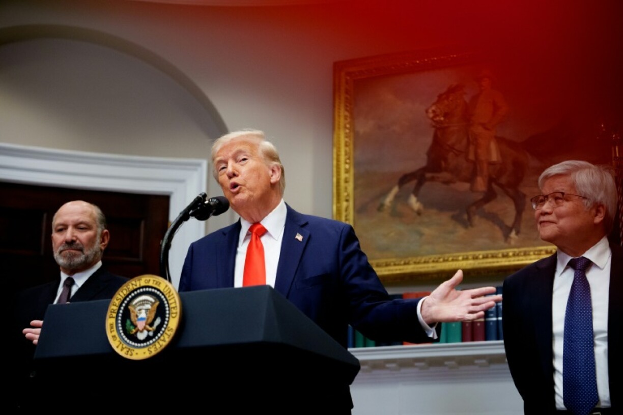 US President Donald Trump, accompanied by Commerce Secretary Howard Lutnick (L) and Taiwan Semiconductor Manufacturing Company (TSMC) CEO C.C. Wei (R), speaks in the Roosevelt Room of the White House on March 3, 2025 in Washington, DC
