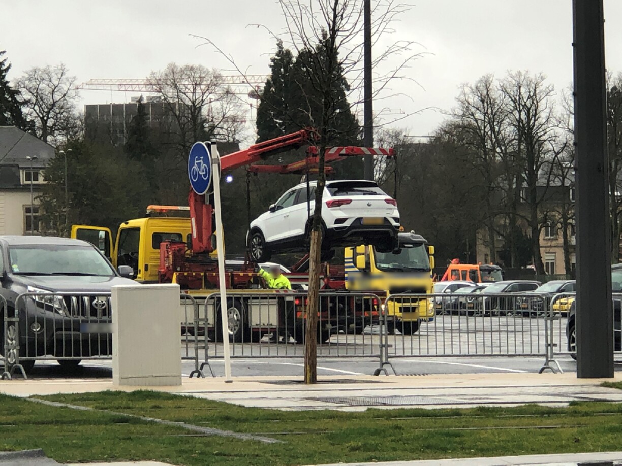 A car being removed from the parking