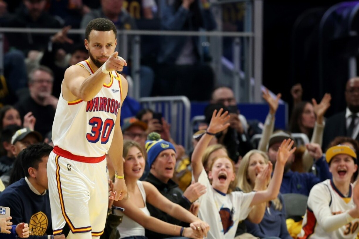 Stephen Curry of the Golden State Warriors reacts after making a 3-point shot in a victory over Philadelphia, part of a personal-best 8-for-8 3-point shooting performance