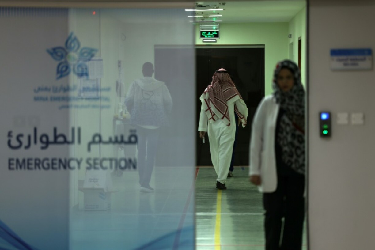 Medics and people walk at a heat stroke treatment unit at the Mina Emergency Hospital in the holy city of Mecca