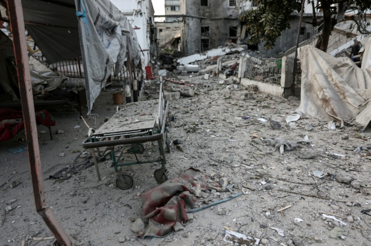 A gurney lies among debris after an Israeli strike on the Al-Ahli hospital, also known as the Baptist or Ahli Arab hospital, in Gaza City