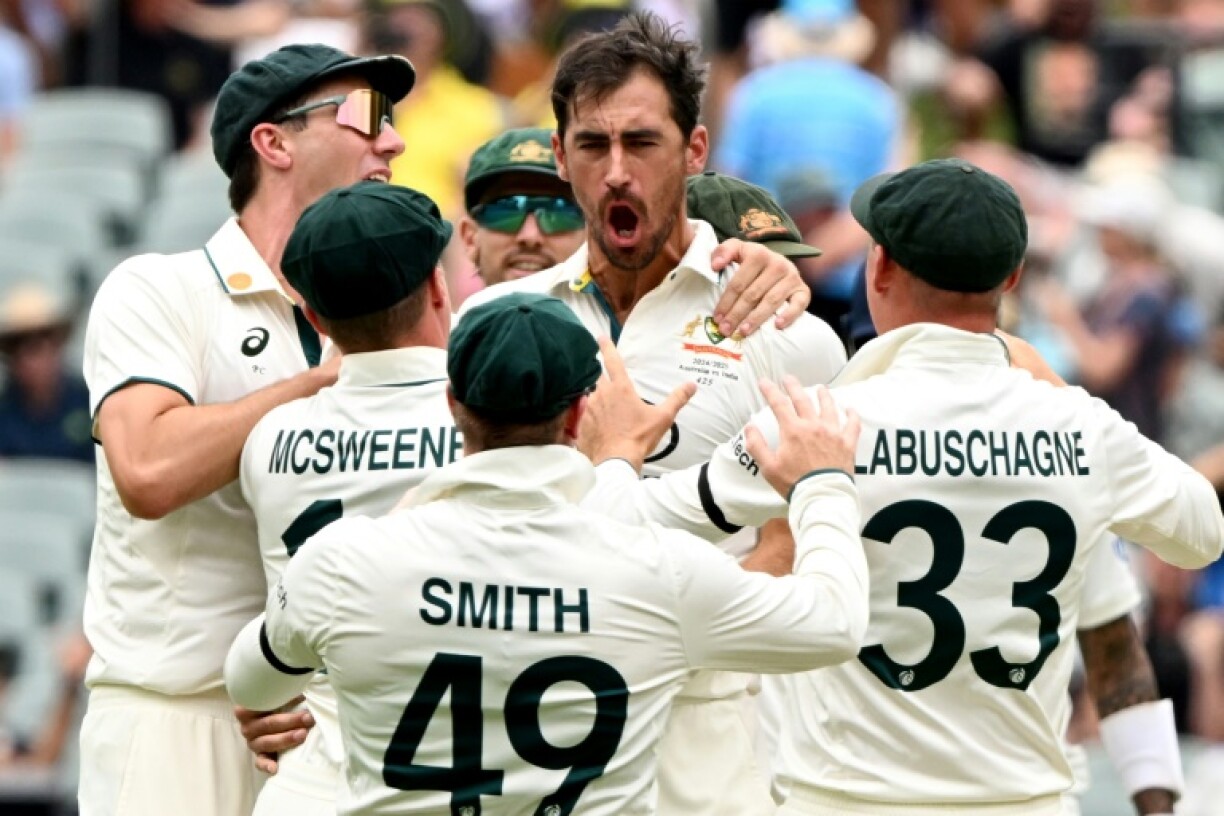 Australian bowler Mitchell Starc (C) celebrates the wicket of Indian batman Yashasvi Jaiswal in the second Test at Adelaide