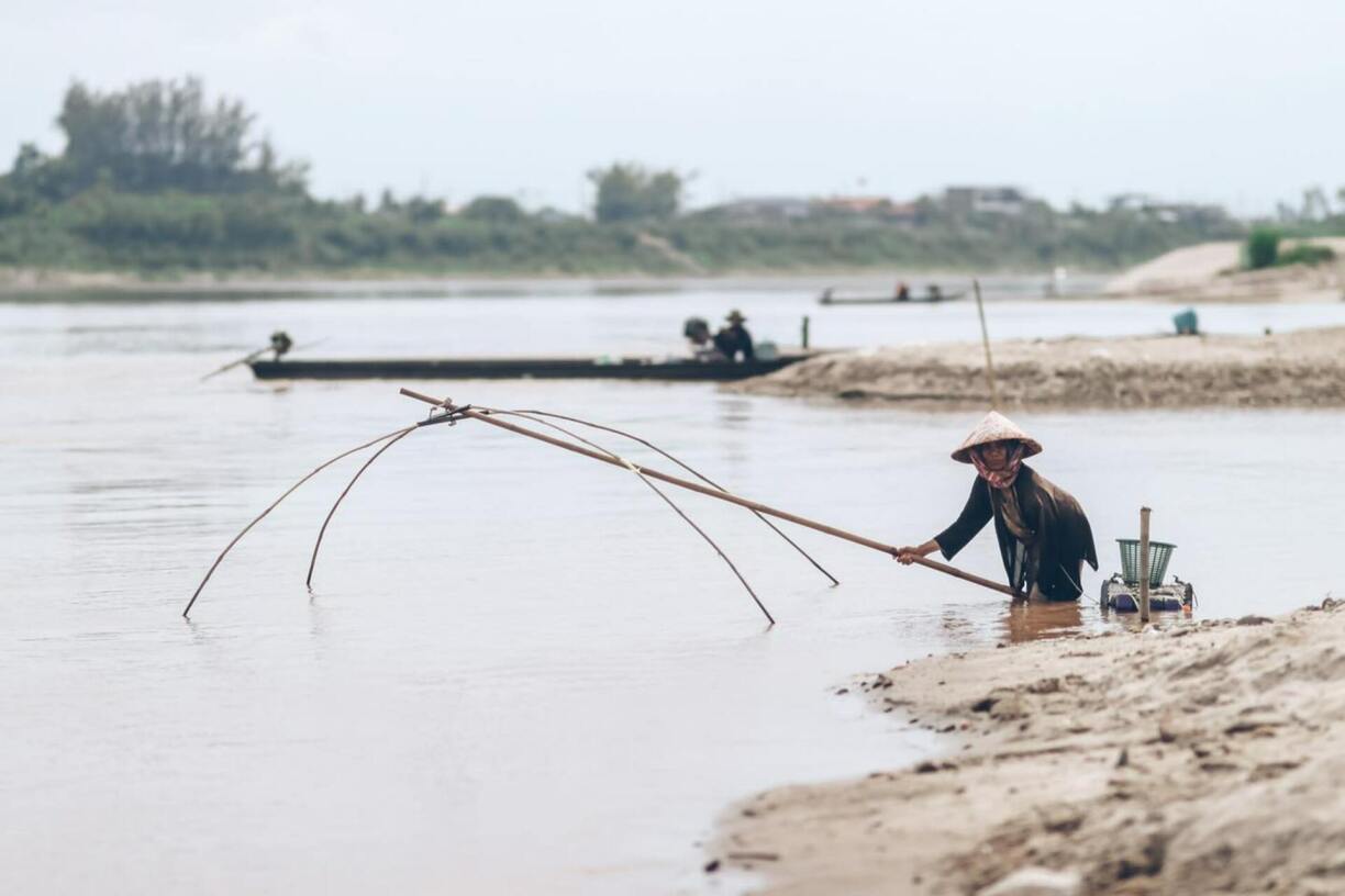 A fisherwoman in Laos