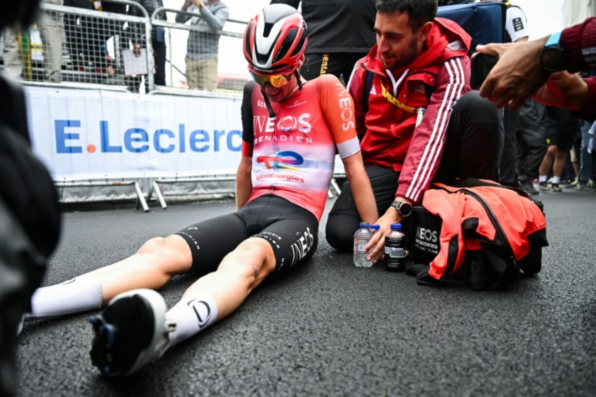 Thymen Arensman celebrates after winning the 14th stage