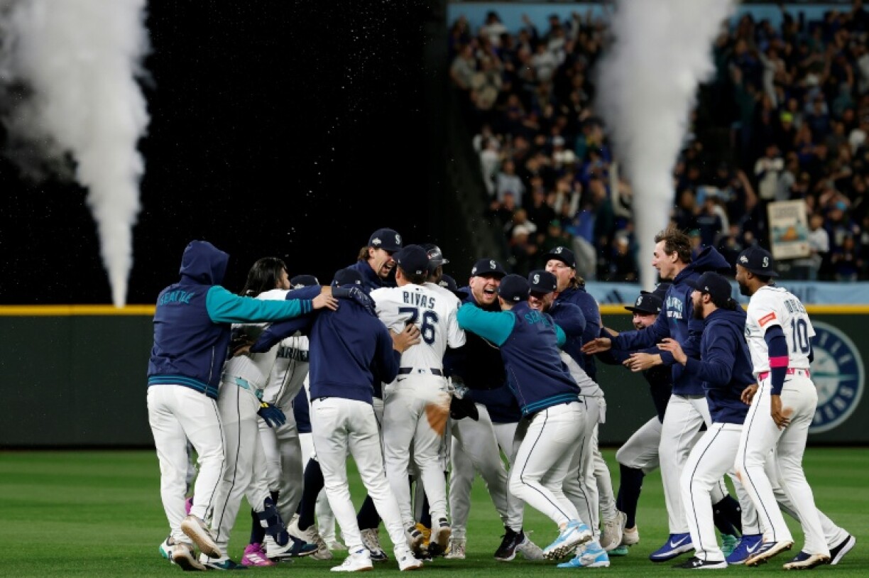 The Seattle Mariners celebrate their series-clinching, 15-inning victory over the Detroit Tigers in the Major League Baseball playoffs