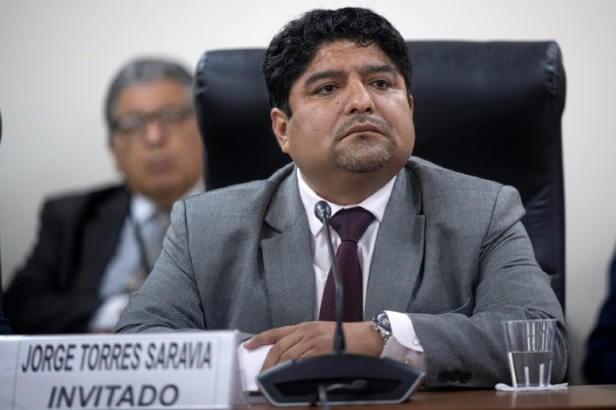 Jorge Torres, former head of Peru's congressional legal and constitutional office, is questioned by a parliamentary oversight committee
