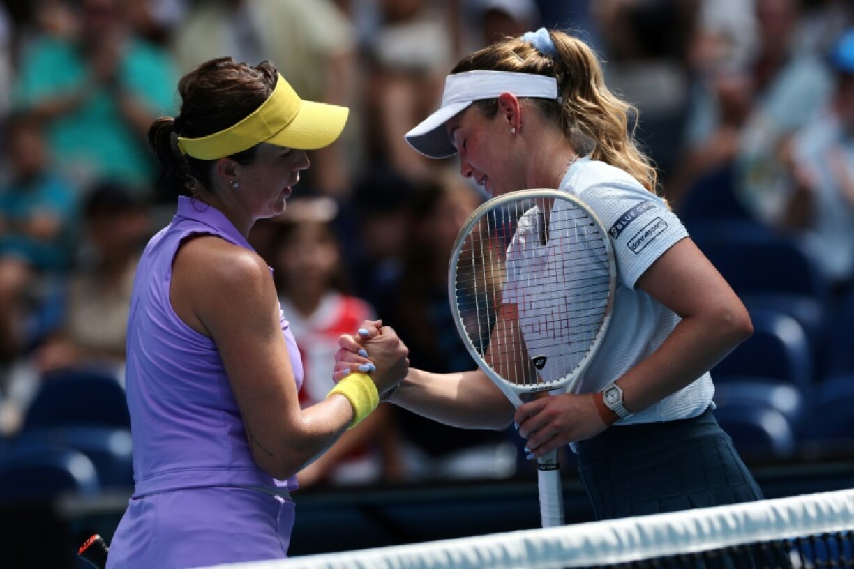 Anastasia Pavlyuchenkova (left) shakes hands with Donna Vekic after their match