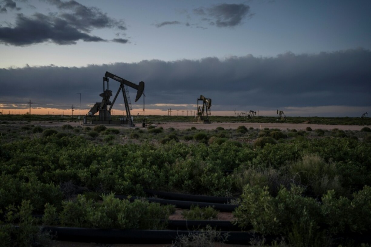 Pump jacks operate at dusk near Loco Hills on April 23, 2020 in Eddy County, New Mexico