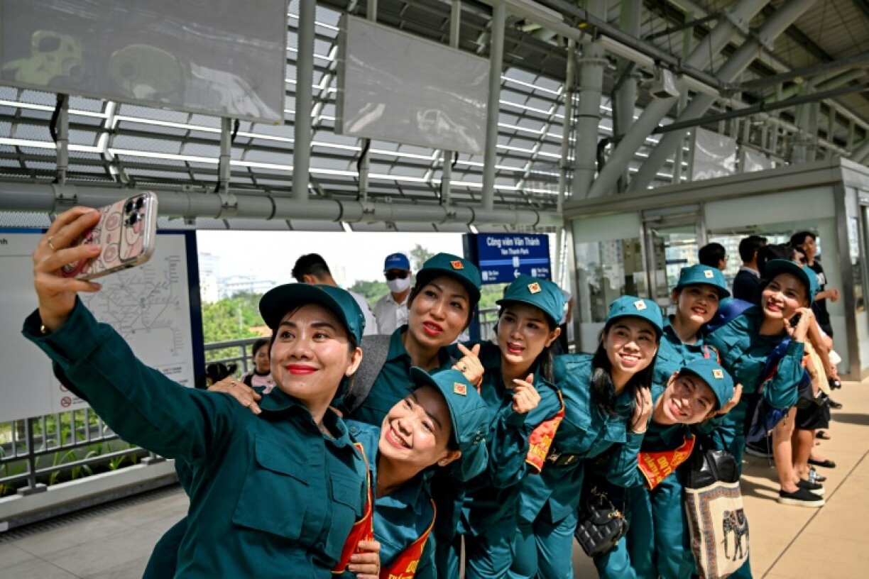 Vietnamese soldiers were among the thousands taking selfies on the new metro in Ho Chi Minh City