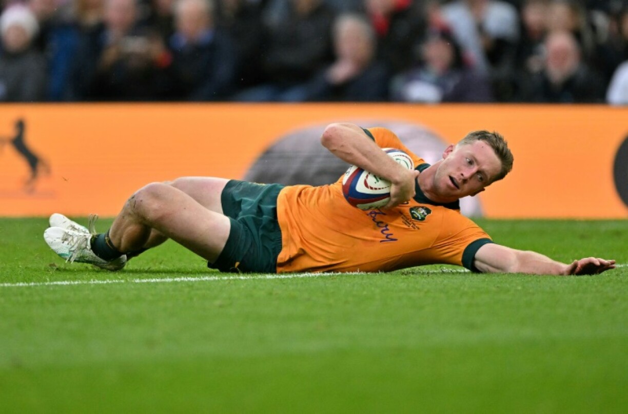 Australia wing Harry Potter dives over to score a try against England at Twickenham