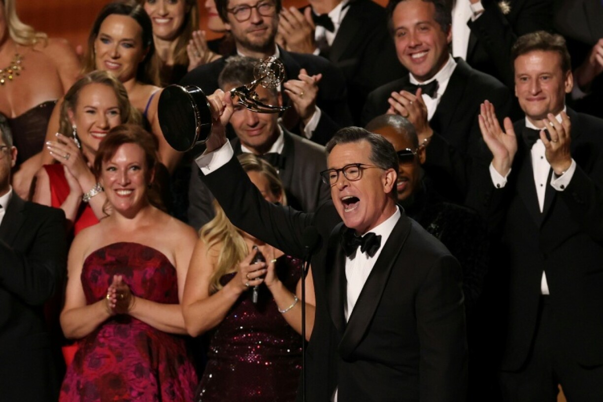 Stephen Colbert accepts the Outstanding Talk Series Emmy to cheers from the audience