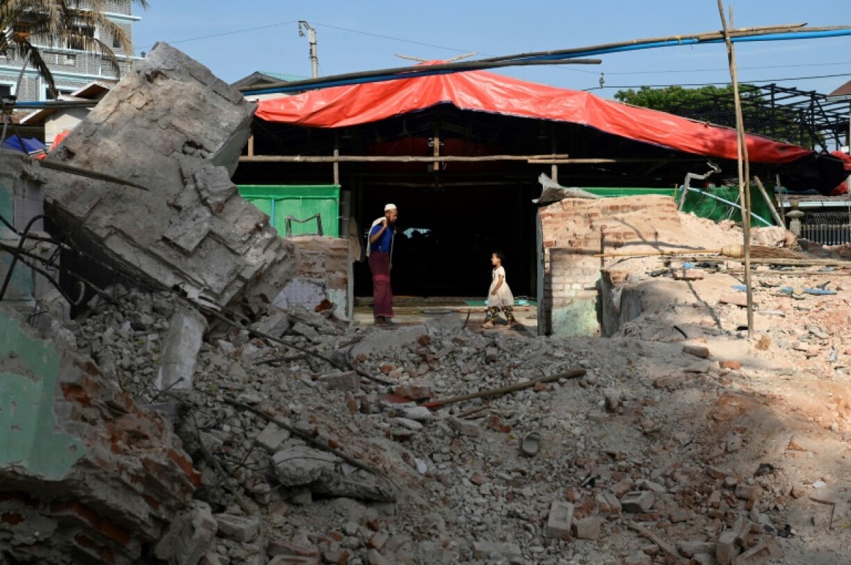 Two weeks on from the disaster which killed more than 3,600, hundreds are still living in tent encampments peppered among pancaked apartment blocks