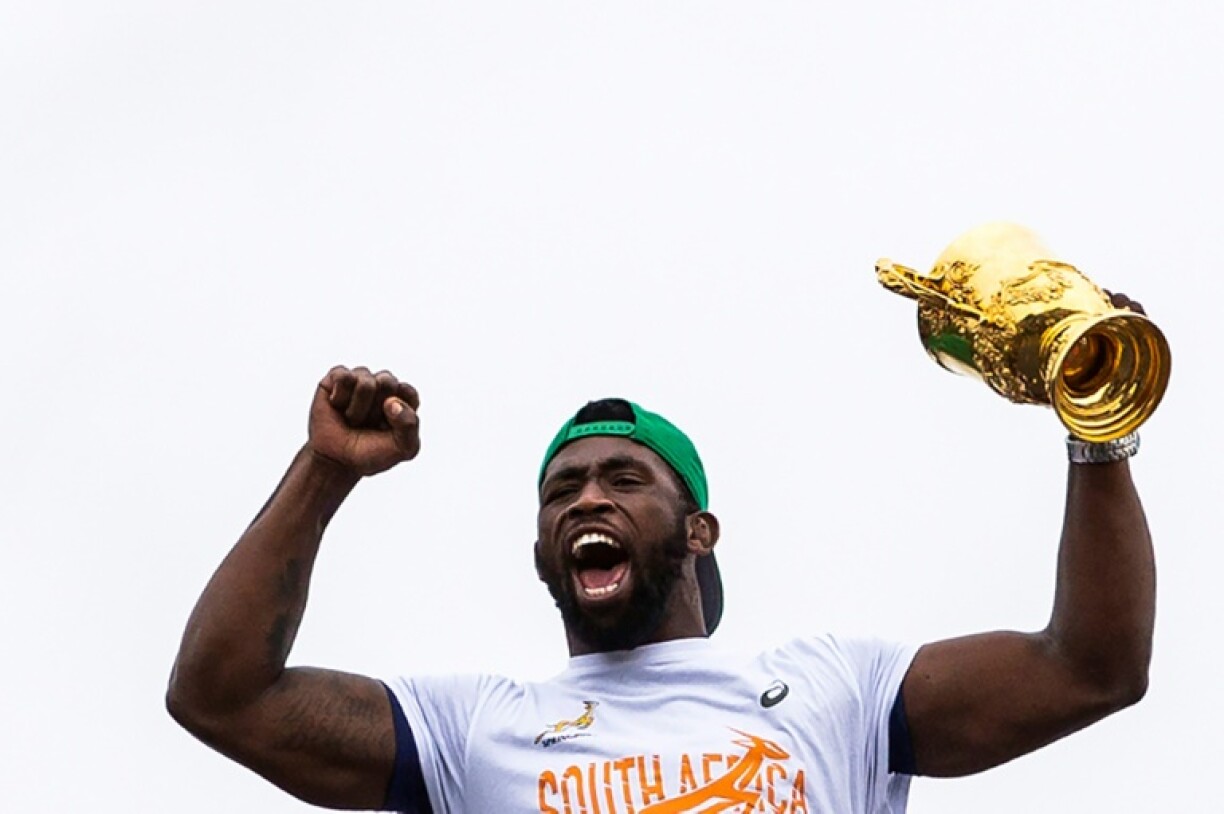 Siya Kolisi holds aloft the 2019 Rugby World Cup on a tour of his township of Zwide