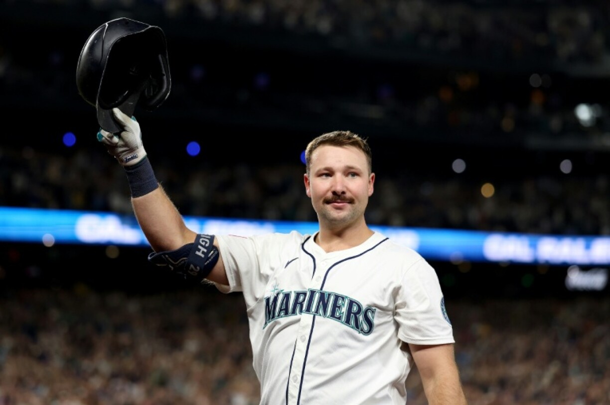 Cal Raleigh of the Seattle Mariners celebrates his 60th home run of the Major League Baseball season in a 9-2 victory over the Colorado Rockies
