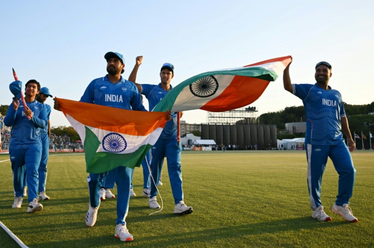 India's players celebrate their victory over Pakistan in the 2026 Asian Games cricket final at the Korogi Athletic Park