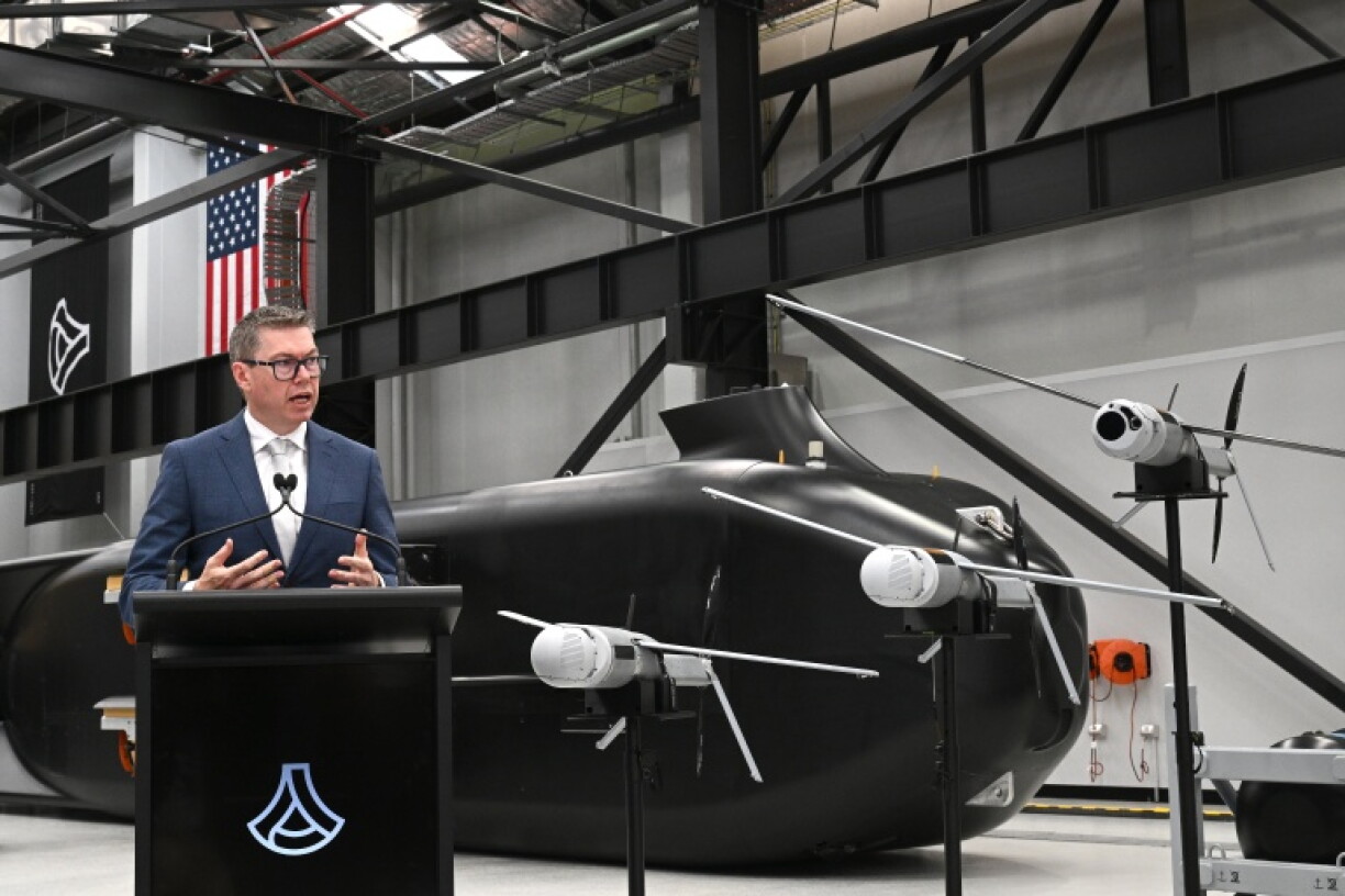 Australia's Minister for Defence Industry, Pat Conroy, speaks to the media in front of the autonomous undersea vehicle Ghost Shark at an Anduril facility in Sydney on October 19, 2026