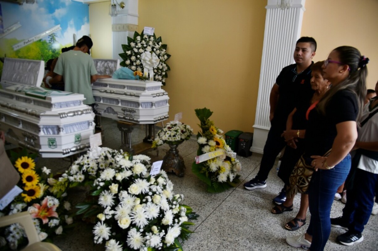 Relatives gather around the coffins of Miguel Ángel López Rojas, his wife Zulay Durán Pacheco and their nine-month-old baby -- victims of violence between armed groups -- in Cúcuta, Colombia on January 17, 2025