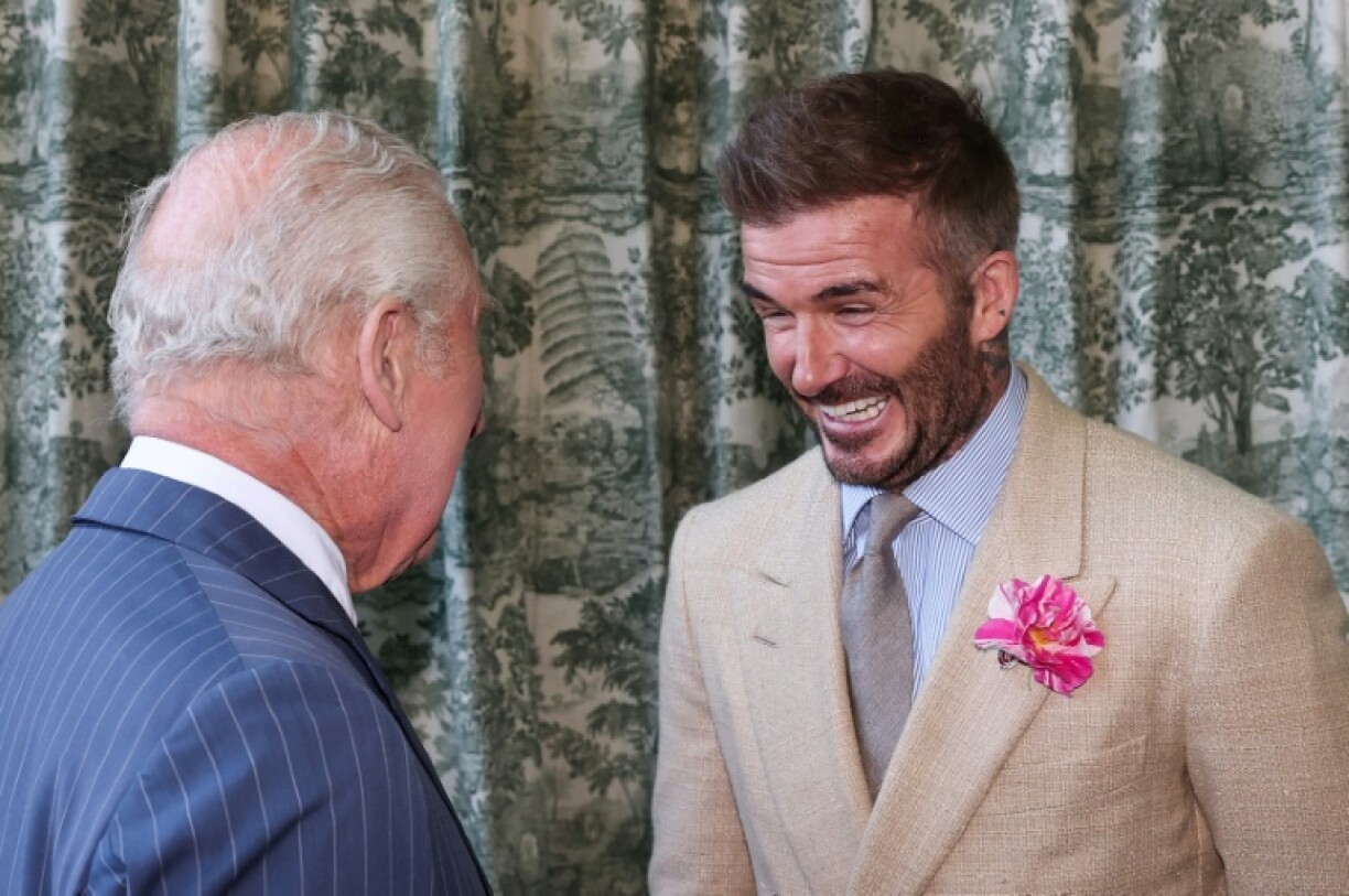 Britain's King Charles III speaks with former England captain David Beckham at the Chelsea Flower Show in London in May 2025