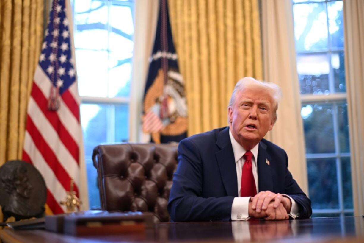 US President Donald Trump speaks to journalists in the Oval Office of the White House in Washington, DC, on January 30, 2025.