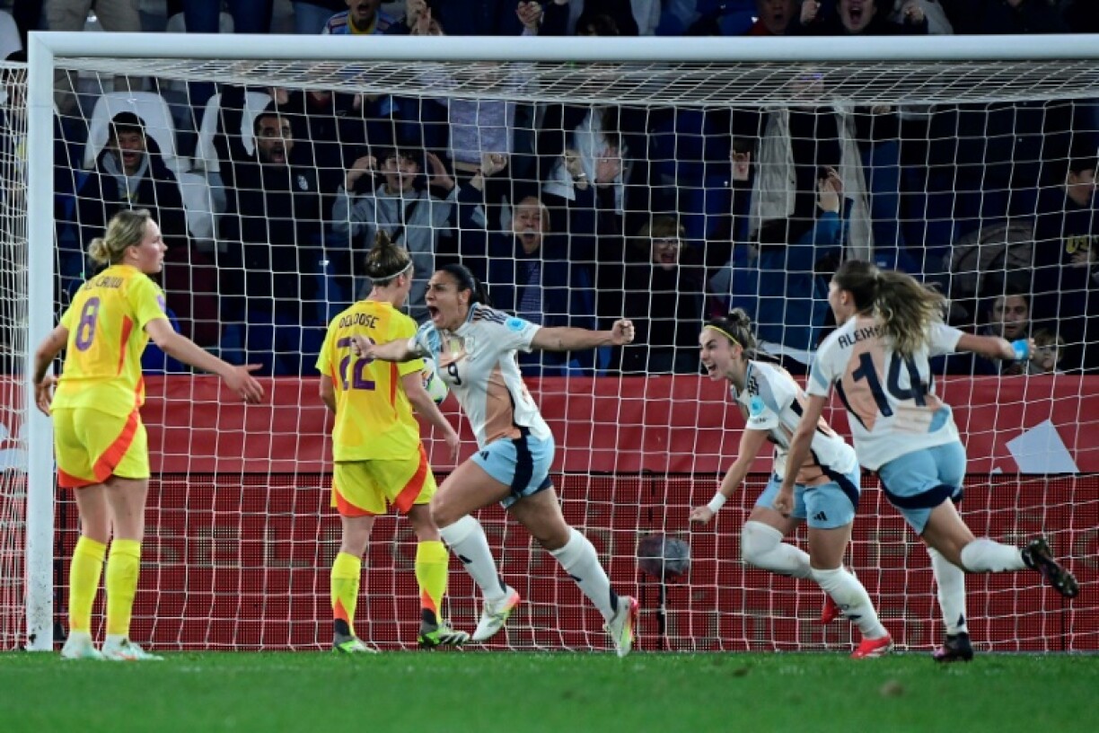 Spain's Cristina Martin-Prieto (C) celebrates scoring her team's third goal late on against Belgium